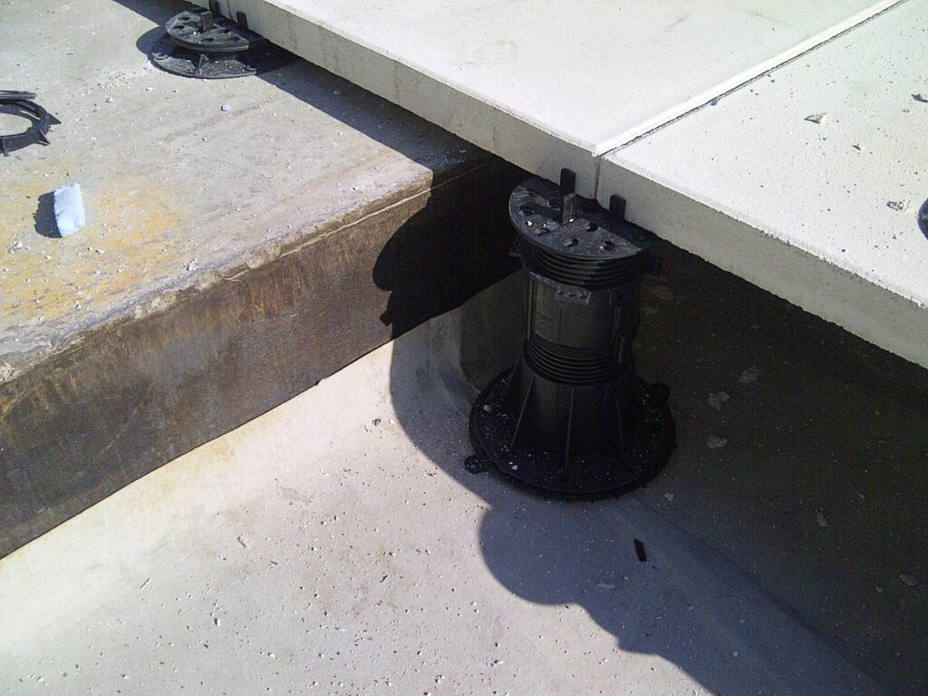 Span Unequal Heights with Adjustable Height Buzon BC Series Pedestals with Concrete Pavers