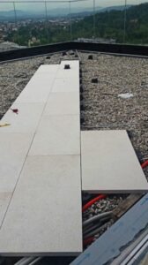 Structural Porcelain Pavers over Buzon Pedestals with Electrical Conduit Below Deck