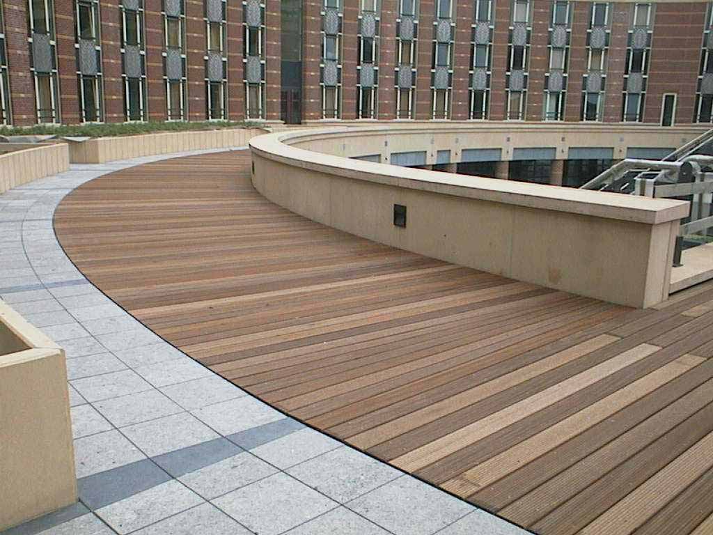 Buzon Pedestals With Wood Decking and Stone Pavers in School Walkway