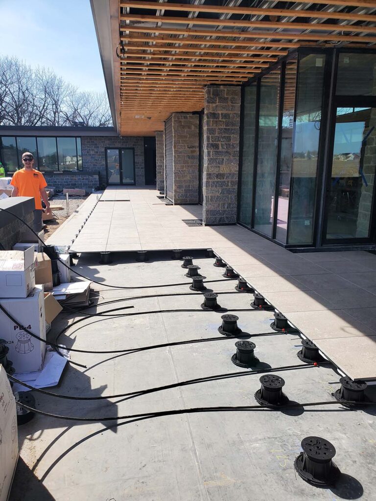 Buzon Pedestal an Porcelain Pavers in Snow Melt System