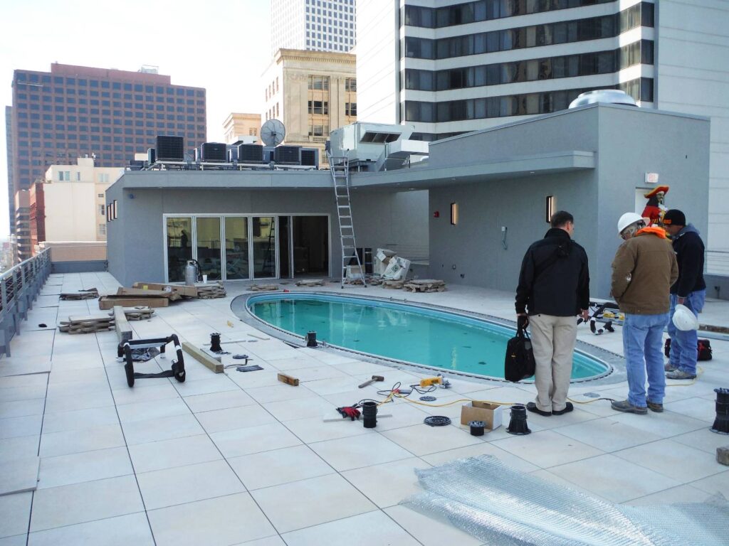 Erik Nelson Visiting Buzon Pedestals Rooftop Pool Deck Installation