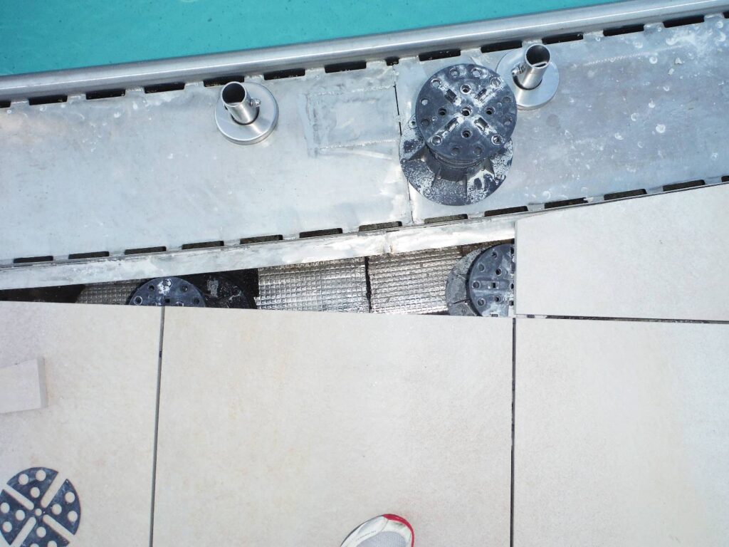 Top Down View of Pool Deck with Porcelain Pavers and Buzon Pedestals Underneath