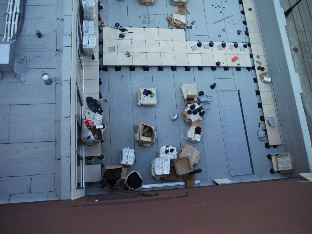 View Down the Building Wall of Rooftop Deck Installation in Process