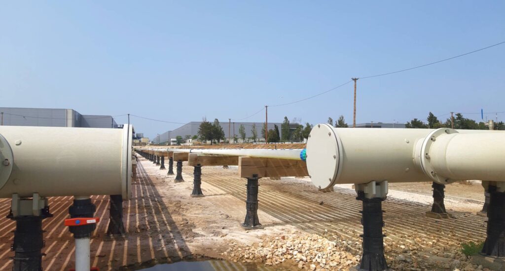 Large industrial pipes set over Buzon pedestals