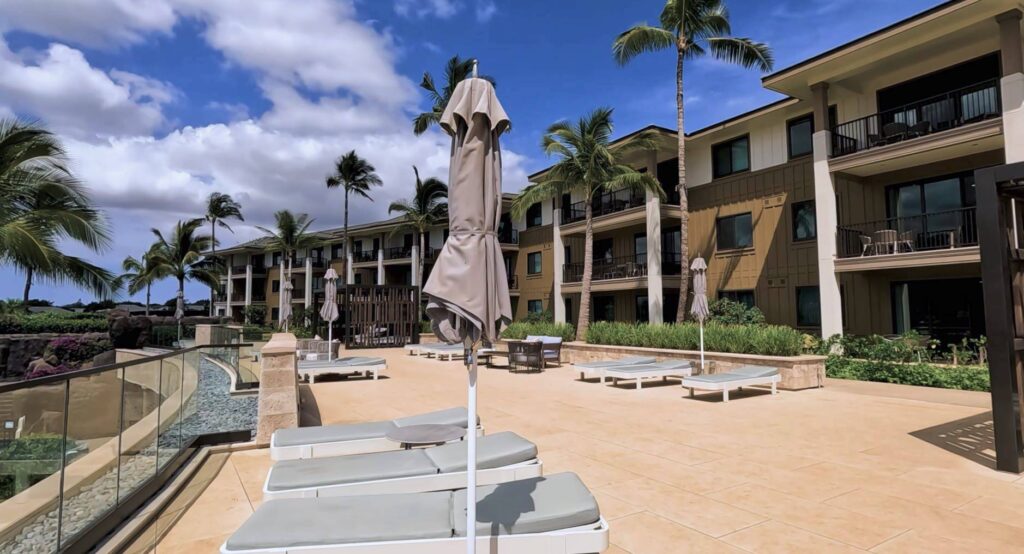 Terrace Promenade with Porcelain Pavers Over Buzon Pedestals and Glass Balustrade