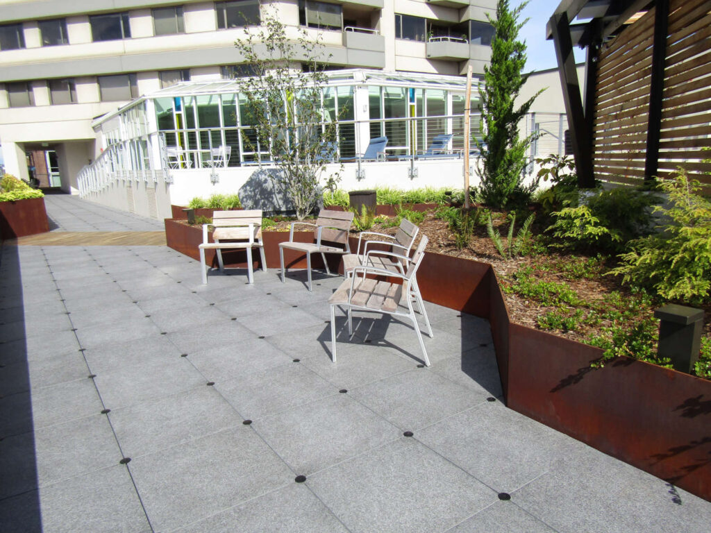 Rooftop Deck with Porcelain Pavers Over Buzon Pedestals with U-Washer Wind Protection