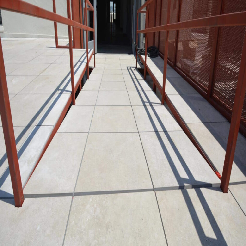 Creating ADA Accessible Ramps and Inclines on Rooftop Terrace Using Porcelain Pavers and Buzon Pedestals