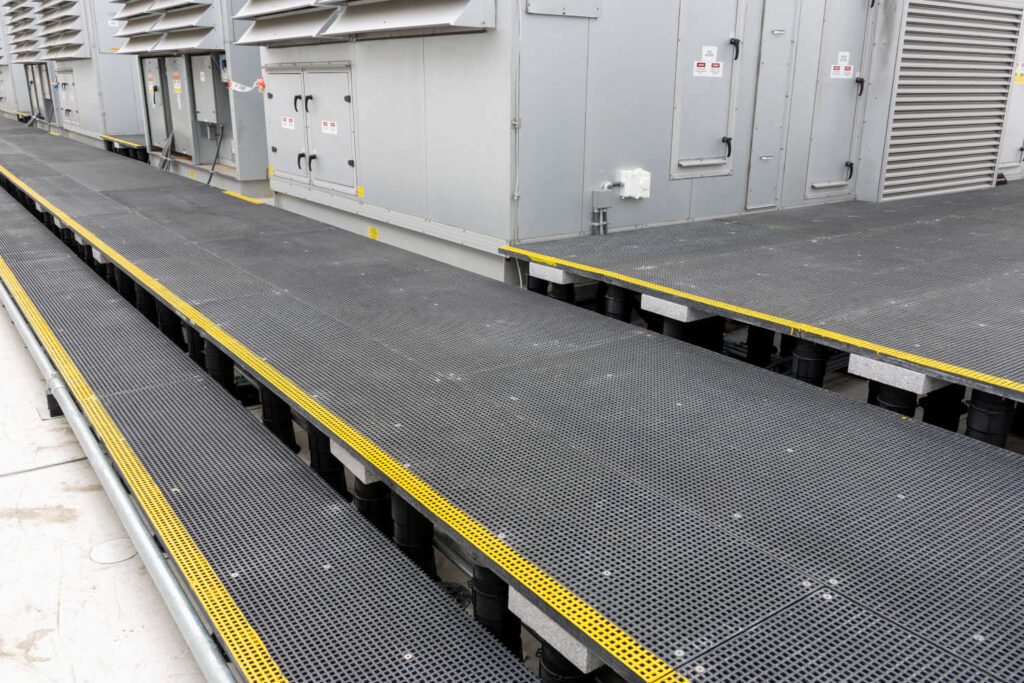 Fiberglass Grating Materials Over Buzon Pedestals for Industrial Access
