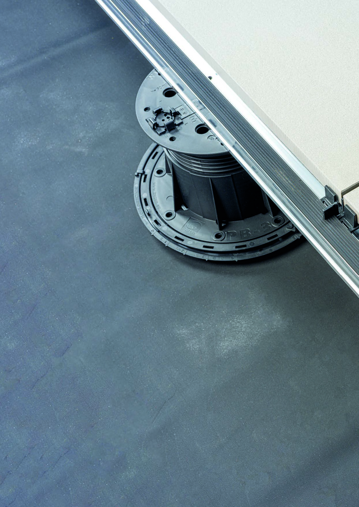 Buzon E-BRS Easy Rail System Showing Pedestal, Slope Corrector, Aluminum Joist with Alignment Hole and Integrated Drainage, U-BRS Spacer Tabs, EPDM Shims, and HDG Porcelain Pavers