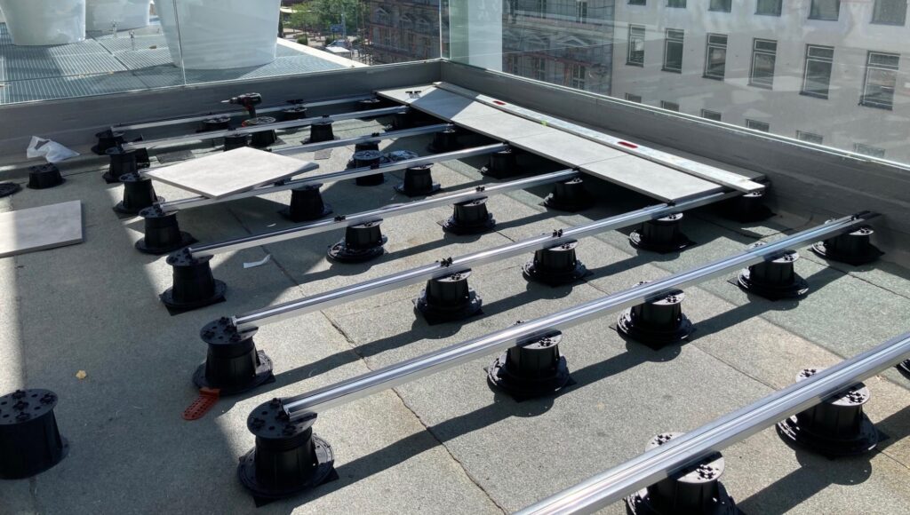 Buzon E-BRS Easy Rail Aluminum Joist System With HDG Porcelain Paver on Rooftop Deck