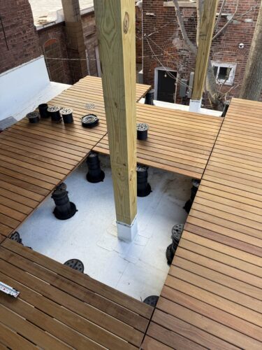 Buzon Pedestals Seen Below the Ipe Decking Surface