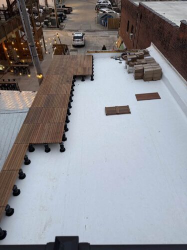 First Row of Ipe Pavers Is Installed the 60 Foot Length of Rooftop Deck