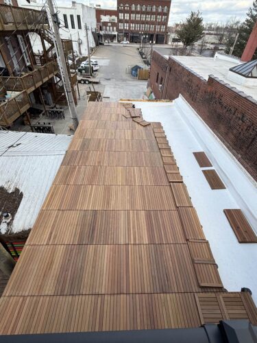 Sea of Ipe Pavers over Buzon Pedestals on Rooftop Deck Transformation