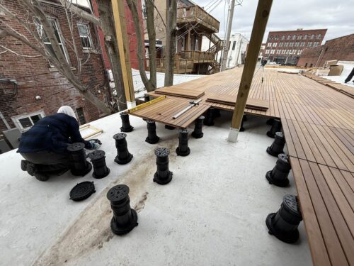 Navigating Pedestals and Pavers Around Arbor Posts on Rooftop Deck