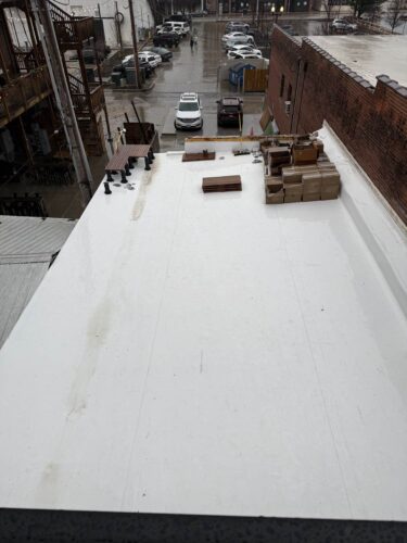 Rooftop Deck Transformation Beginning at Back Corner with First Row of Pedestals