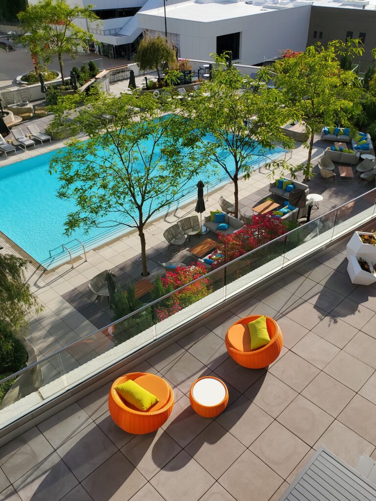 Kimpton Sawyer Hotel pool surround and balcony using Buzon pedestal systems for architects with concrete and porcelain pavers.