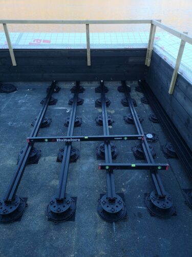 Completed corner with multiple E-BRS Easy Rail joists in place with levels.