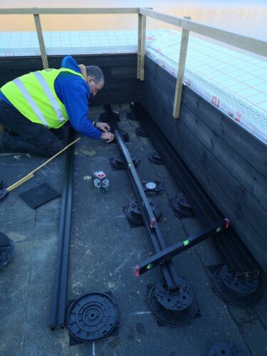 E-BRS double-rail setup and leveling between joists.